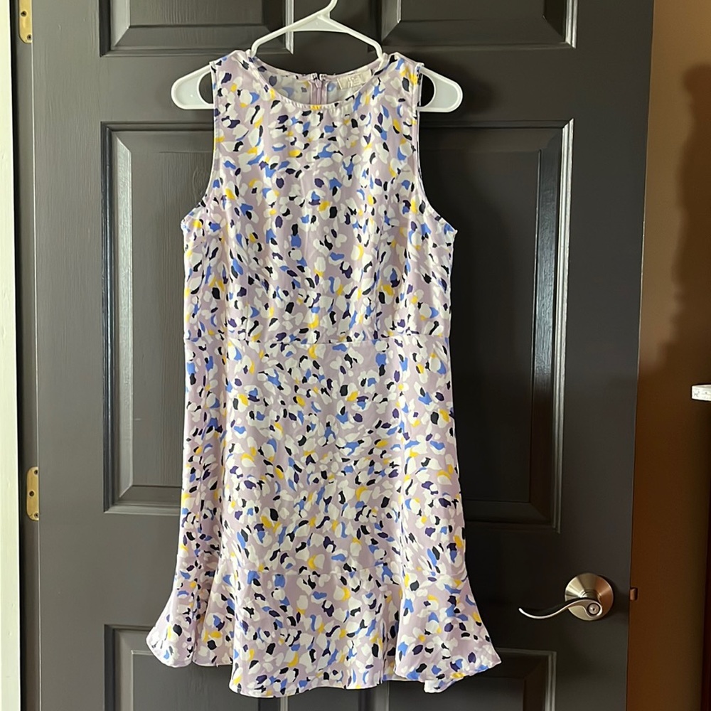 Very cute Loft sleeveless dress. Purple is the base color zips in the back